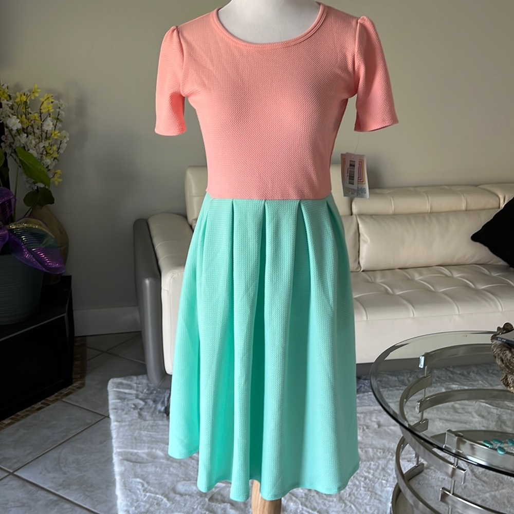This  beautiful mint green and peach Amelia dress is perfect for Easter.